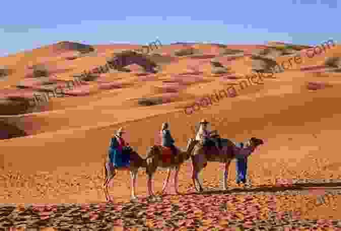 A Group Of Travelers On Camels Traversing The Vast Sands Of The Sahara Desert Discover The SAHARA Desert: Feel It Before You Live It