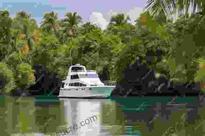 Boat Anchored In A Serene Lagoon At Sunset A Sea Vagabond S World: Boats And Sails Distant Shores Islands And Lagoons